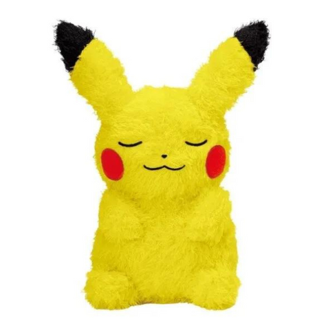 A pikachu plush made of super fuzzy yellow fabric. He's in a seated position with his eyes closed and a smile on his face like he's sleeping peacefully.