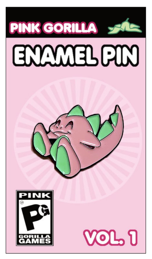 An enamel pin with our former mascot character, a pink and green dinosaur. The pin is on a light pink pin backing, which says Pink Gorilla Enamel Pin, Vol. 1