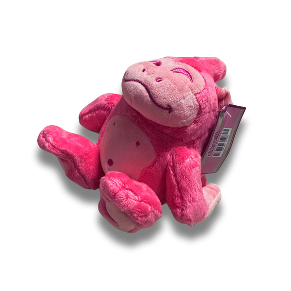 A three quarters arial view of the small pink gorilla plush. His fur is a fluffy bright pink and his facial details are nicely embroidered.