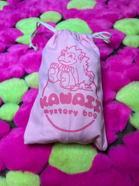 Image of a Kawaii mystery bag. The bag is pink with a pink gorilla logo on it.