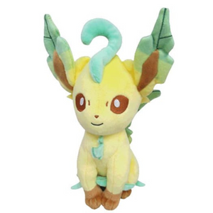 A sitting plushie of Leafeon from Pokemon. He's light yellow-beige with green leafy ears.