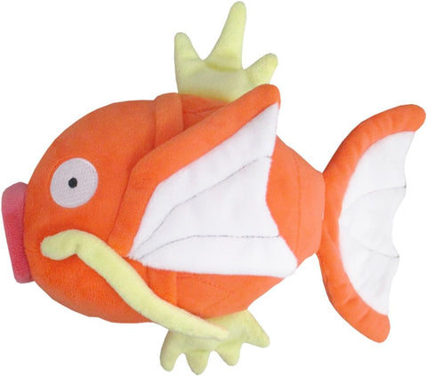 An orange Magikarp plush. He has yellow fins, whiskers, and red lips.