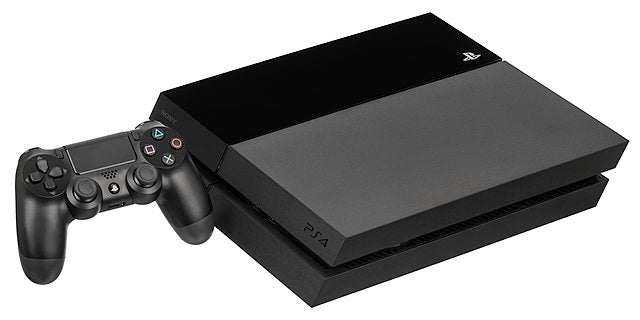 Playstation 4 console pictured lying horizontally. There is a black PS4 dual shock 4 controller next to it. Photo by Evan Amos, Wikimedia commons.
