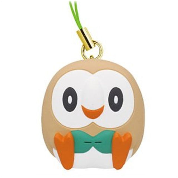 A light brown rowlet sitting keychain, with a green strap.