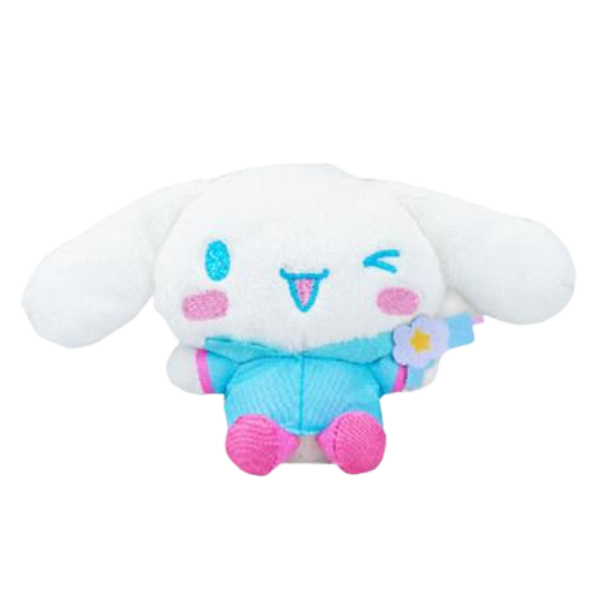 A fluffy high quality plush of Cinnamoroll wearing a blue raincoat with pink accents. His boots are pink and he's holding a blue water gun.
