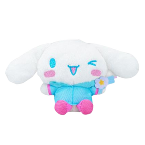 A fluffy high quality plush of Cinnamoroll wearing a blue raincoat with pink accents. His boots are pink and he's holding a blue water gun.
