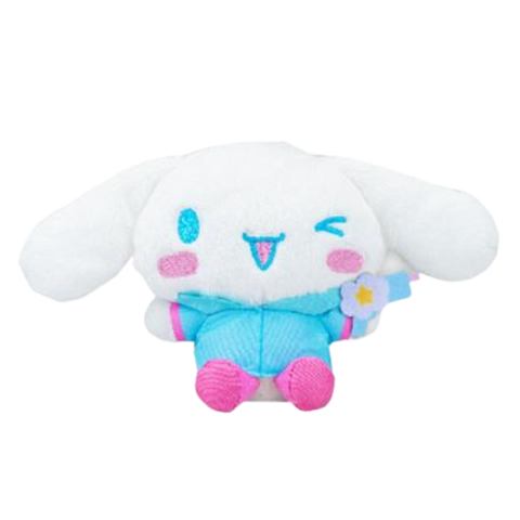 A fluffy high quality plush of Cinnamoroll wearing a blue raincoat with pink accents. His boots are pink and he's holding a blue water gun.
