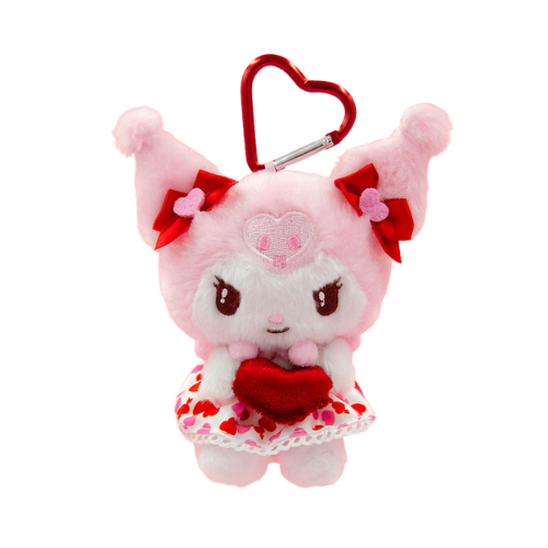 A pink and white Kuromi plush keychain. She is wearing white and red heart-print dress, has red bows below her ears, and is holding a red velvet heart. A red heart-shaped clip is attached to her head.