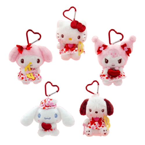 A group of pink and white Sanrio plush keychains. Hello Kitty, MyMelody, Kuromi, Cinnamoroll, and Pochacco are wearing white and red heart-print dresses and bows. A red heart-shaped clip is attached to their heads.