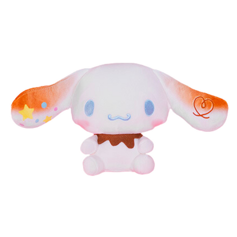 A soft cinnamoroll plush with ears that look lightly "toasted" like a marshmallow. He has a ring of melted chocolate around his neck.