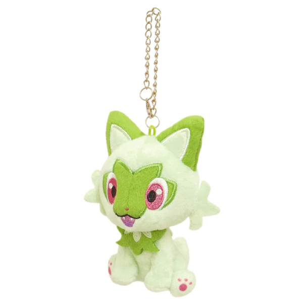 A small green sprigatito plush in a seated position. His eyes, paws, and face details are nicely embroidered.
