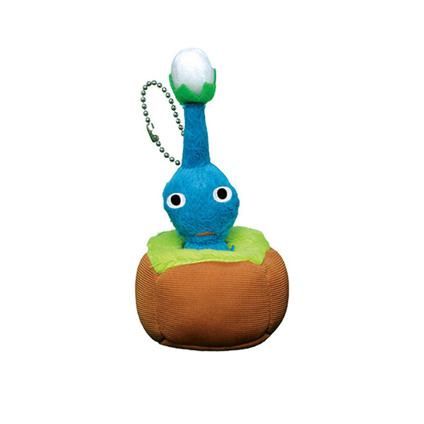 Blue plush pikmin in a plush dirt and grass base.