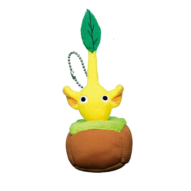 Yellow plush pikmin in a plush dirt and grass base.