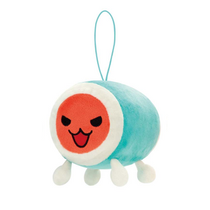 A small soft plush of Don from Taiko Drum Master. He has a blue and white body and and orange red face, with narrowed "angry" eyes and a smile.