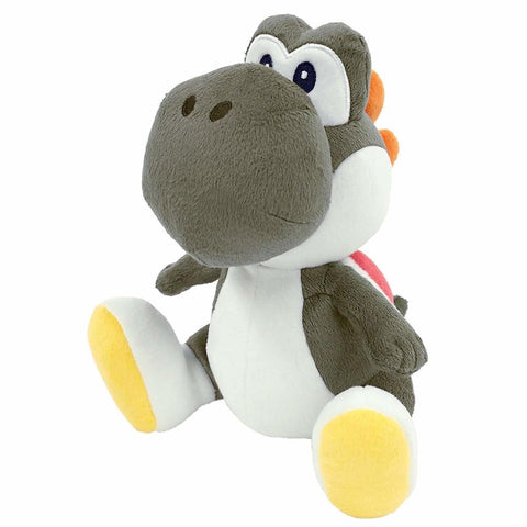 A black and white yoshi plush with white and yellow shoes.